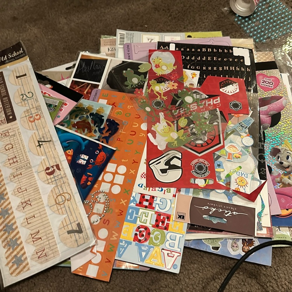 Mixed pile of stickers and other embellishments